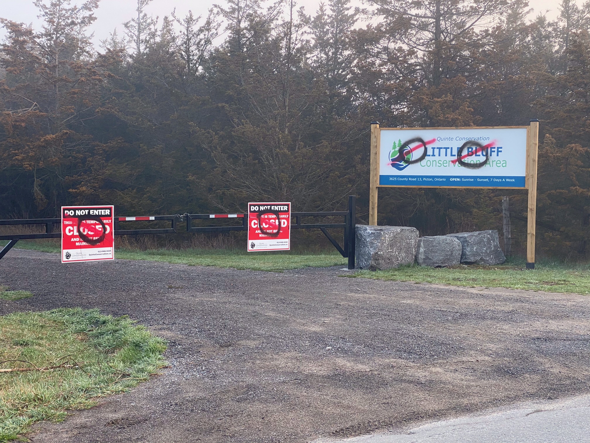 Spray paint over Little Bluff entrance sign.